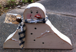 Primitive Wood Snowman  1672SNB Melting Snowman homespun scarf, rusty bell, and 'I'd melt for you' tag.